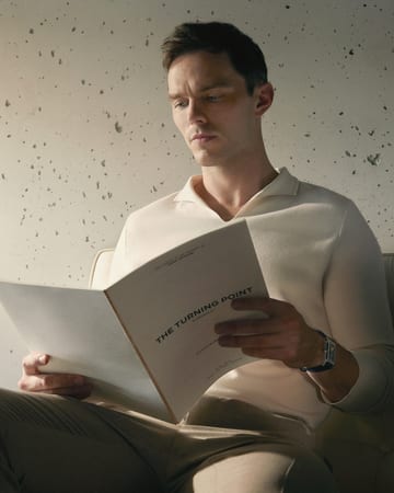 Nicholas Hoult reading a book